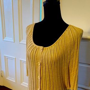 Large, fits SM light sleek sweater top in a golden tan color with short sleeves.